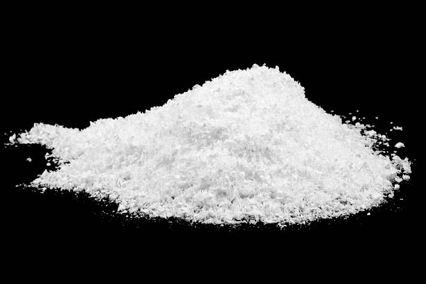istock Heap of white snow isolated on a black background 1437072441