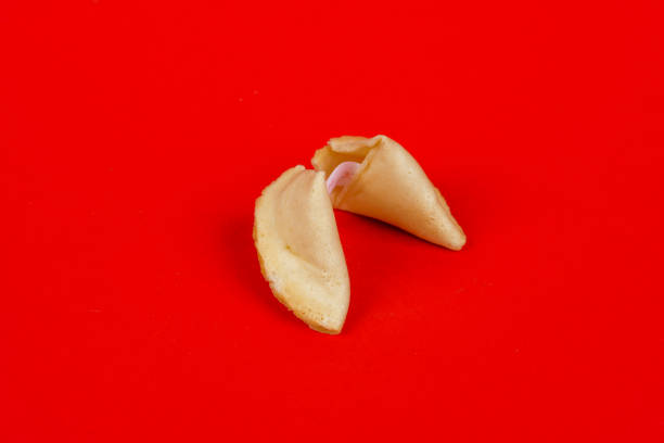 Fortune cookie on red background stock photo