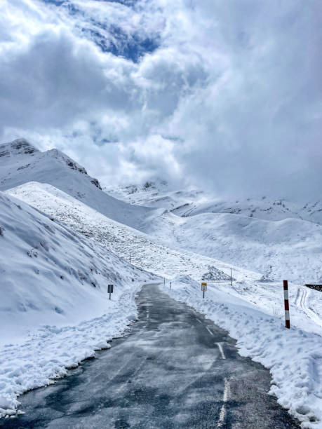 istock snowy road on a blue day 1437073016