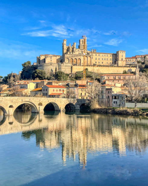 reflection of the medieval bridge over the river reflection of the medieval bridge over the river in France beziers stock pictures, royalty-free photos & images