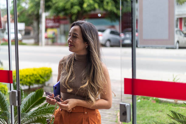 istock Latin woman arriving at a store 1437079926