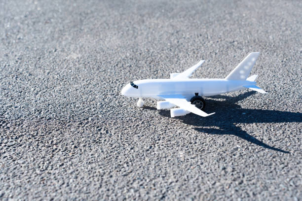 istock Toy aircraft parked on the road 1437081985