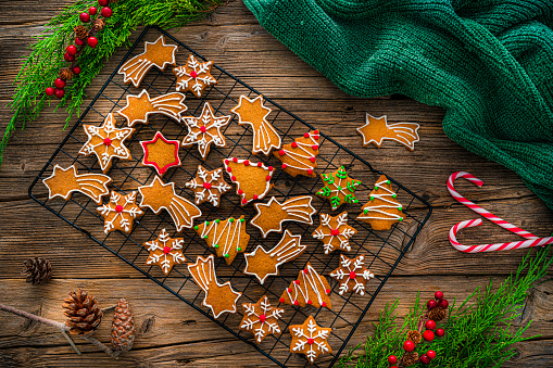 Overhead view of Christmas gingerbread cookie on a cooling rack shot on rustic wooden table. Zeiss Batis 40mm F2.0 CF lens