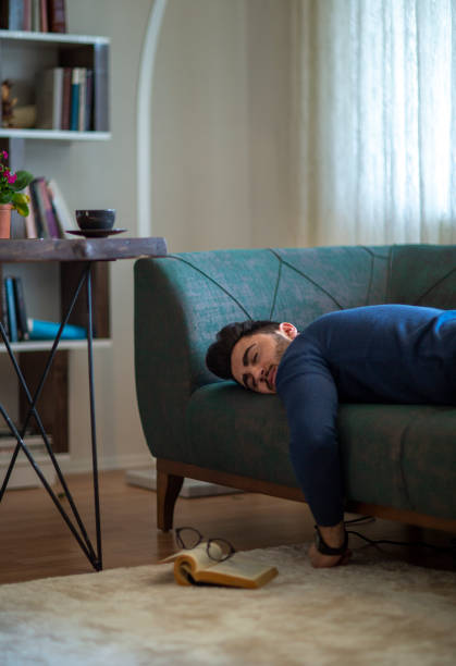 Flopping Down 150+ Man Falling Asleep On Couch Stock Photos, Pictures & Royalty-Free ...