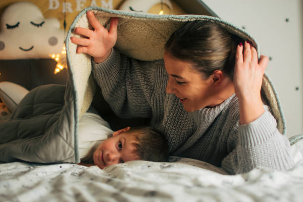 istock mom and son under the duvet 1437087309
