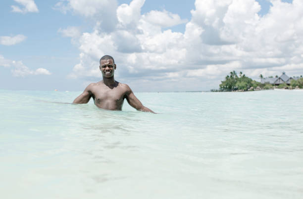 istock Happy black man with naked torso looking at camera 1437088774