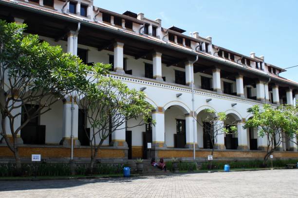 istock Lawang Sewu Old Building with trees and blue sky 1437090692
