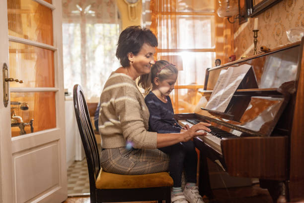 istock Girl learning the piano 1437091612