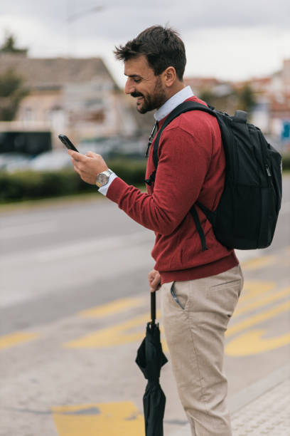 modern young businessman on his way to work - color image bus discussion expertise imagens e fotografias de stock