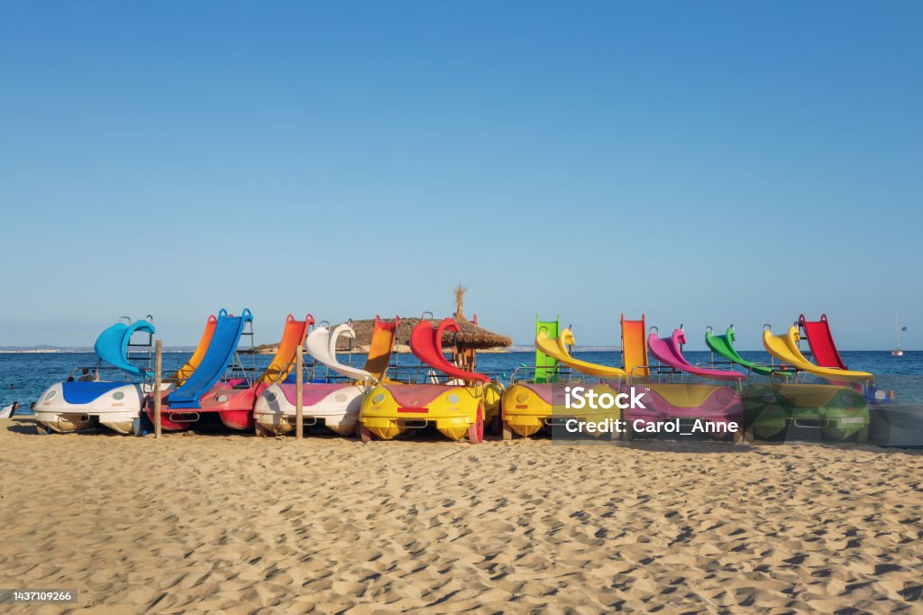 Bright colorful pedal boats with water slides at the beach in Magaluf, Majorca, Spain Pedal Boat Stock Photo