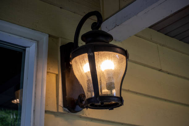 istock Close up, low angle view of an old fashioned lantern on a porch 1437116220