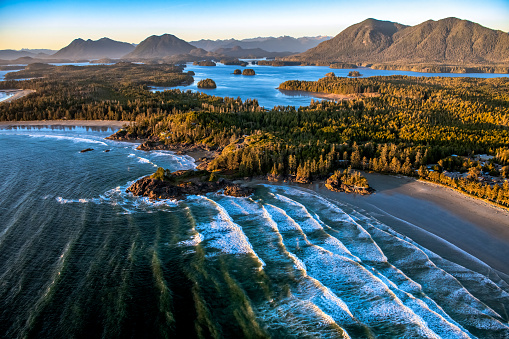 Aerial shot of Cox Bay Beach from helicopter, Tofino, Vancouver Island, BC Canada