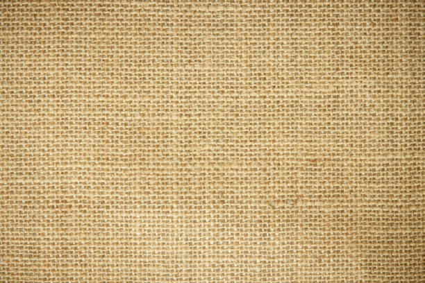 istock Jute hessian sackcloth burlap woven, linen texture pattern background in light beige cream brown color blank. Natural weaving canvas fiber line cotton cloth textured as clean organic for decoration. 1437123672