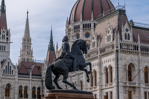 Budapest, Hungary - 1st September 2022: Rakoczi Ferenc equestrian statue in front of the Hungarian Parliament Building in Budapest