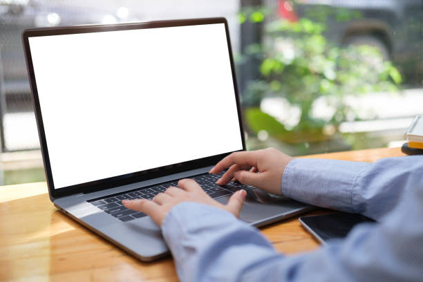 istock Young businesswoman sitting at comfortable workplace and using laptop computer. 1437135551