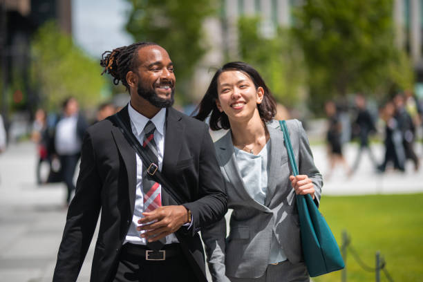 istock Happy Office Employees Going To Work With A Smile On Their Faces 1437136131