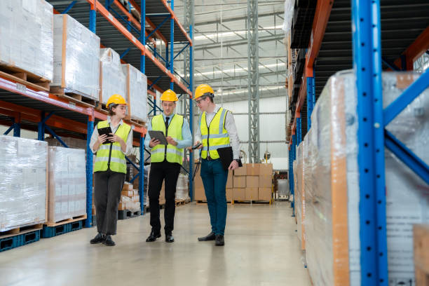 istock Warehouse worker taking package in the shelf in a large warehouse in a large warehouse 1437138098