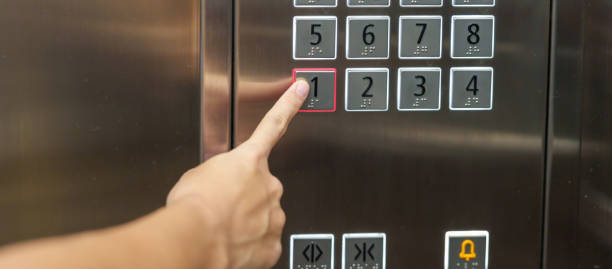 istock Hand finger press the Elevator button, woman using Elevator in office or apartment 1437153679