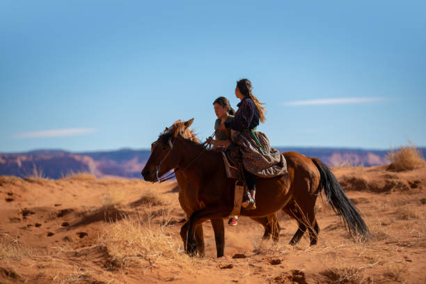 istock Sisters riding on horses in Monument Valley Arizona 1437158274