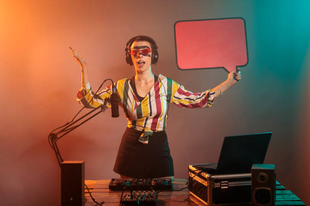 istock Woman DJ holding speech bubble to show message 1437161239