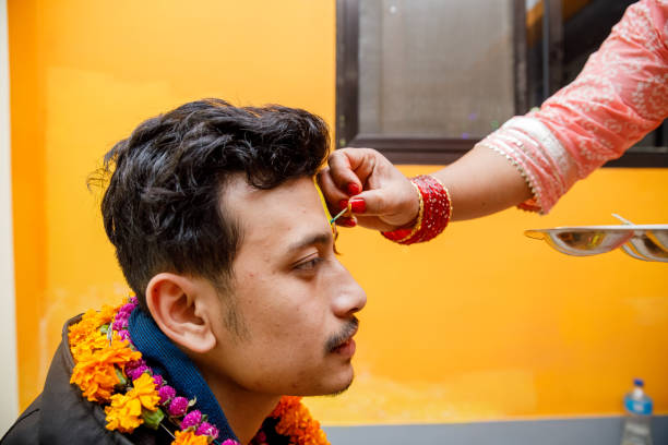 Bhai tika or Kija Puja Bhai tika or Kija Puja is Tihar's last and most important day. The sisters apply Tika to their brothers’ forehead (hence, given the name as ‘Bhai Tika’) Kathmandu, Nepal on 10-27-2022. bhai tika stock pictures, royalty-free photos & images