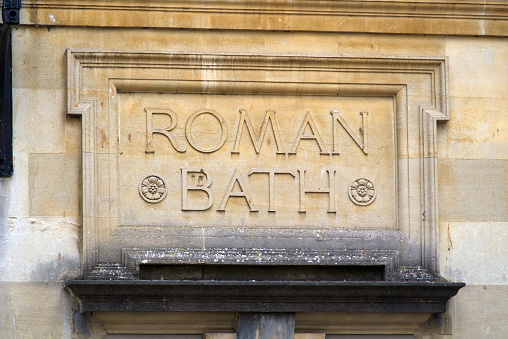 An old sign over an archway in the Stockbridge district of Edinburgh, for an old meat, fruits, fish and poultry market.  A modern weekend community market continues at a nearby site.