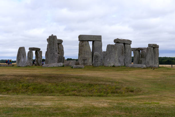 Famous UNESCO World Heritage Site Stonehenge on Salisbury Plain in Wiltshire on a cloudy summer day. hoto taken August 2nd, 2022, Stonehenge, England. stone age stock pictures, royalty-free photos & images