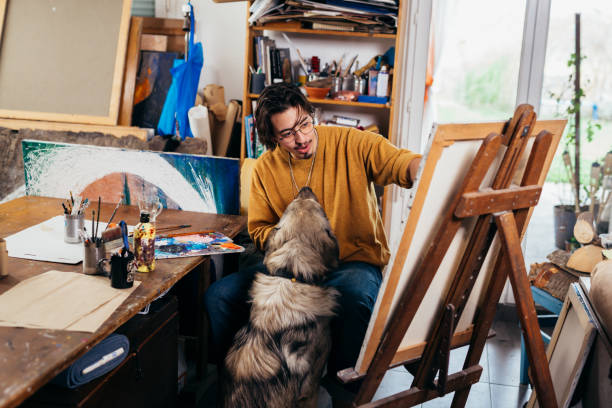 istock Man painting a paint in his atelier 1437173777