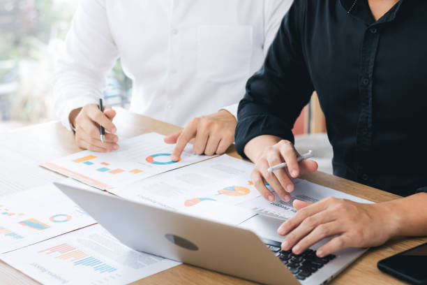 istock Business team using laptop computers analyze business growth and investment, strategic planning to increase sales profits, long-term business plan. 1437173910