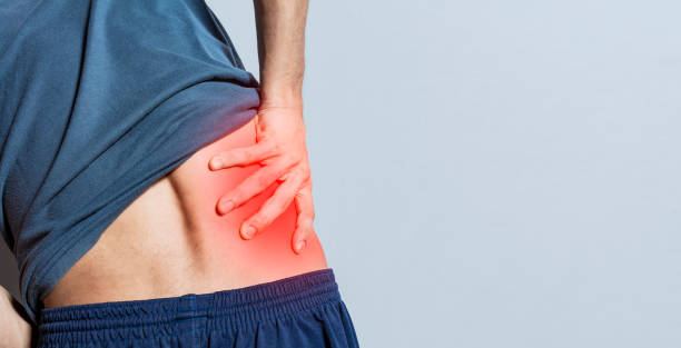 istock Man with spine and lower back problems, people with lower back pain isolated, lumbar problems concept, a sore man with back pain. Unrecognizable people with lower back pain 1437176600