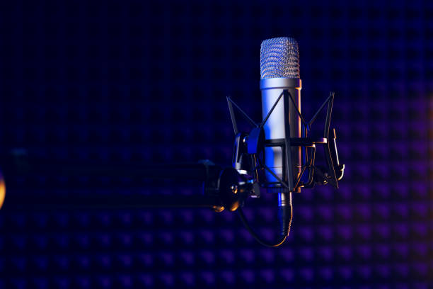 istock Close up of professional microphone in recording studio 1437176690