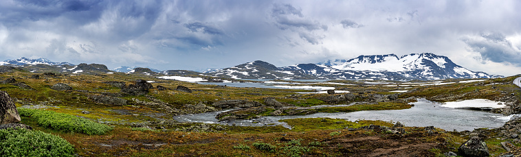 Panorama of the Sognefjellet in Norway with dark storm clouds