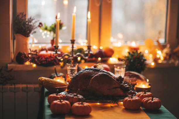 Thanksgiving holiday dinner table setting with fall decoration and pumpkins