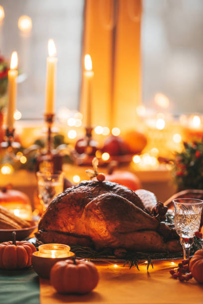 istock Thanksgiving holiday dinner table setting with fall decoration and pumpkins 1437179942