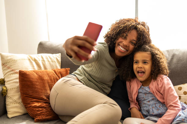 istock Mother and daughter taking selfie 1437181793