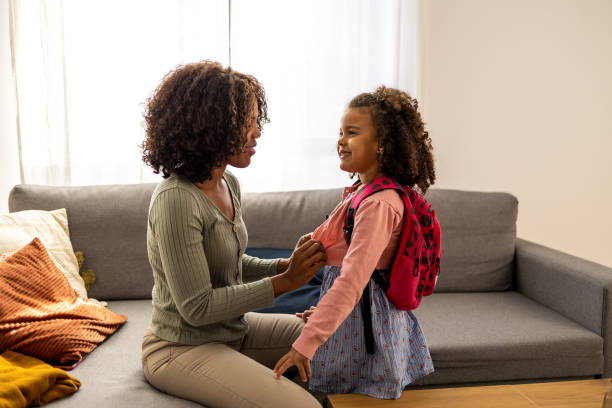istock Mother is preparing her daughter for school 1437181909