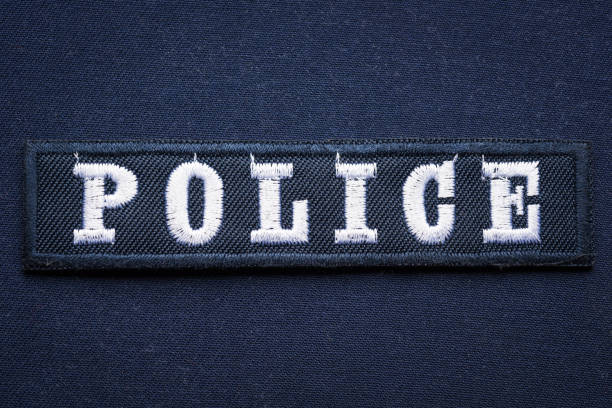 istock Embroidered hook and loop police badge on uniform, close up 1437187258