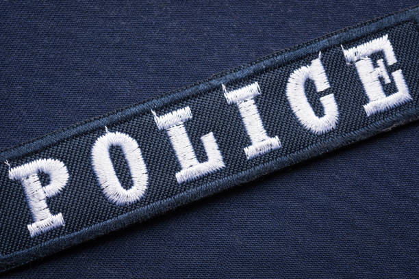istock Embroidered hook and loop police badge on uniform, close up 1437187664
