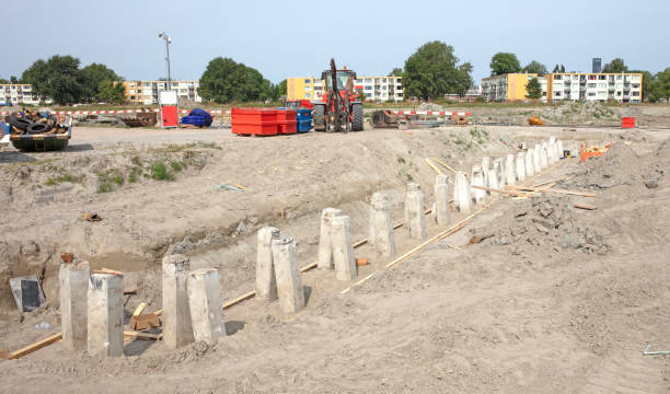 istock Concrete piles foundation for a new building on construction site 1437188949