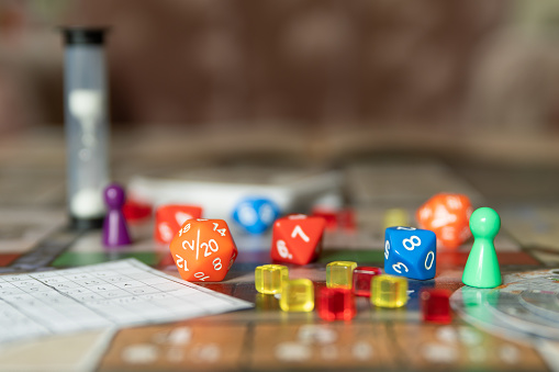 A board game with some figures and dice