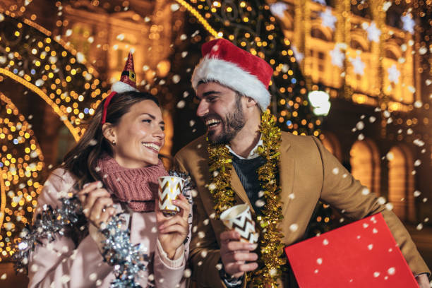 istock Young romantic couple is having fun outdoors in winter before Christmas. 1437190323