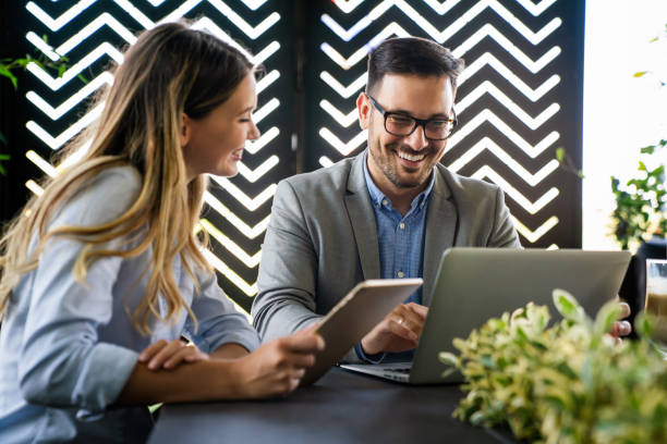 istock Business people working, having fun and chatting at workplace office 1437190611