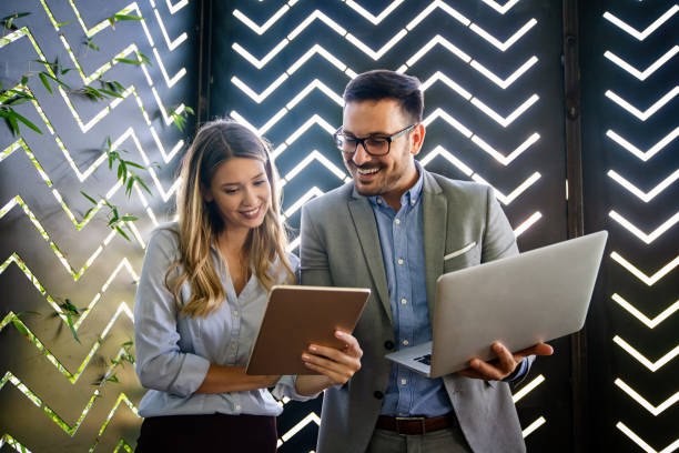 istock Business people working, having fun and chatting at workplace office 1437190612