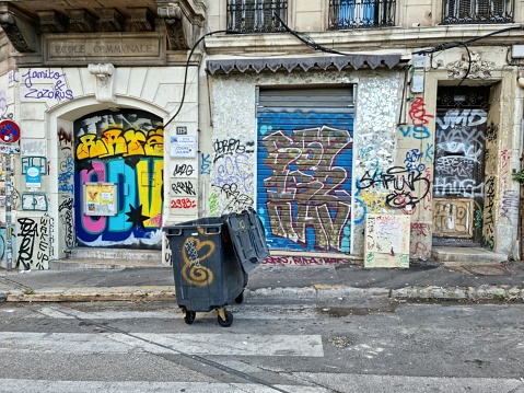 In the heart of Marseille some entrances covered with graffities. The image was captured during autumn season.