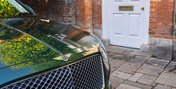 Salisbury Wiltshire, uk, 10, October, 2022 close up of badge and front grill of a classic bentley luxury motor car