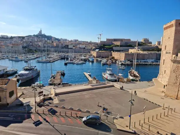 The Vieux-Port de Marseille is the old port of marseille, on the image several buildings and nautical vessels. The image was captured during autmn season.