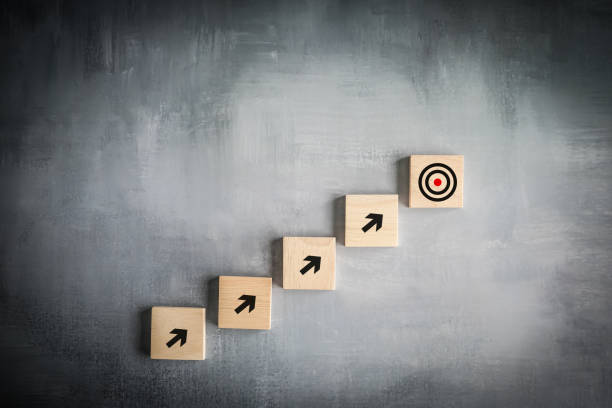 istock Challenge goal and target, Business achievement and objective target. Growing business success concept.  Arrow pointing to the dartboard target step by step. 1437197285