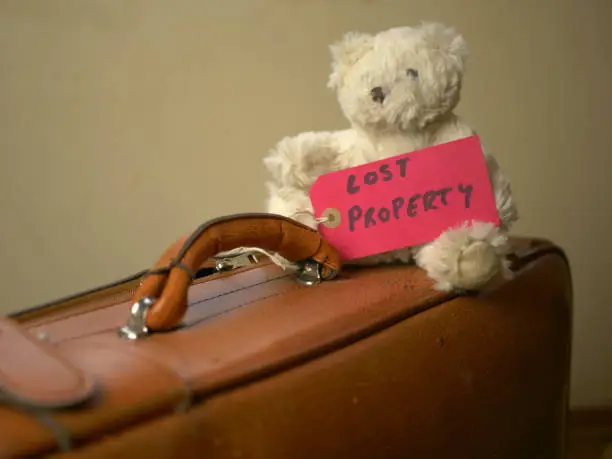 Photo of Bear toy on an old suitcase with a 
