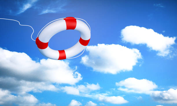 istock Ring lifebuoy on a sky background with fluffy clouds 1437197628