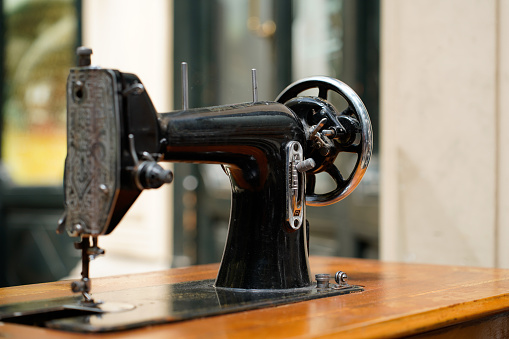 Antique sewing machine. Industrial machine. Pedal sewing machine.